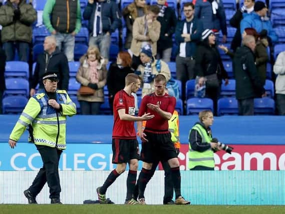 Chris Brunt talks with Darren Fletcher after being hit by a coin thrown by a West Brom fan following his side's 3-1 defeat to Reading
