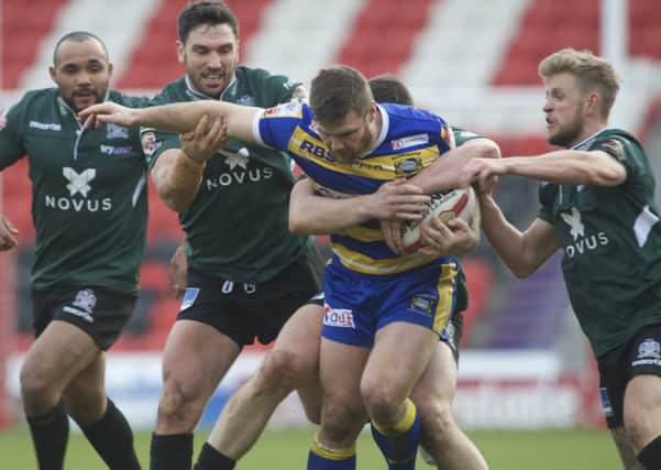 It takes three opponents to stop 
Doncaster's Liam Welham. Photo: Dean Atkins