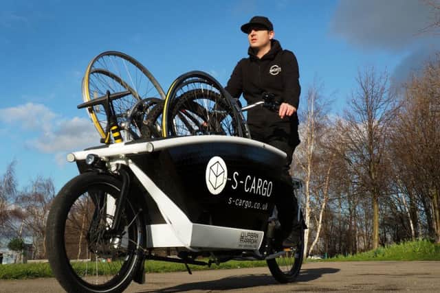 S-Cargo electric cargo bike launch: Karlos Bingham of Recycle Bikes transporting bike wheels