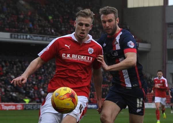 Barnsley defender Marc Roberts in action against Doncaster Rovers