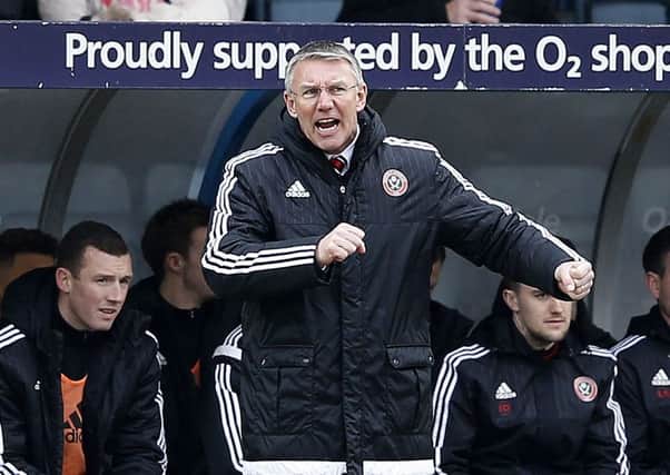 Nigel Adkins manager of Sheffield Utd tries to urge on his players at Rochdale