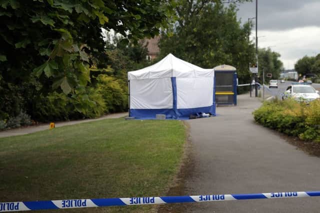 A forensic tent on Fitzwilliam Road in Rotherham following the murder of Mushin Ahmed last summer