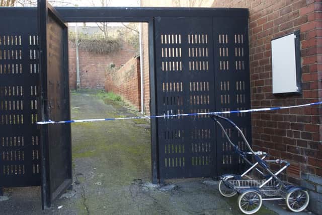 Police tape across the rear access of houses in Lister Avenue in Balby, Doncaster as they investigate a suspected rape 
Picture by Dean Atkins