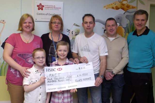 Friends and family of Leukaemia-sufferer Ellie Thompson have raised money for PACT who offer families supports during the child's illness. From left, Mum Lindsey Thompson, Joshua Thompson, Ellie, Beryl Welburn (co-ordinator from PACT), Dad Carl Thompson with Neil Tryner and Trevor Pinder who were two of the friend who joined him on the sponsored walk. Â£4500 was raised