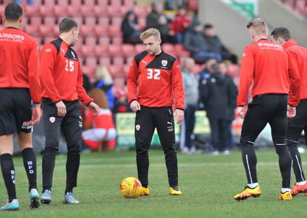 Barnsley 's new on loan signing from Middlesborough Harry Chapman warms up with his new team mates before the win at Crewe. Photo: KeithTurner