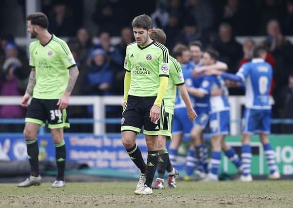 Sheffield united players sare dejected as Rochdale celebrate.  Pic Simon Bellis/Sportimage
