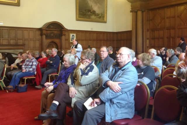 A public meeting on problems with bus services in Sheffield.