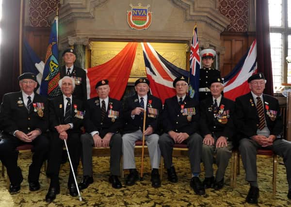 The Sheffield veterans went to the Town Hall to receive their medals. Picture: Andrew Roe