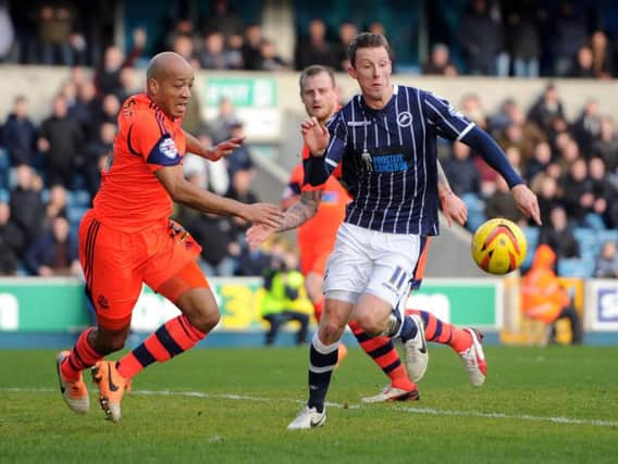 Alex Baptiste, left, in action for old club Bolton against one of his new team mates Martyn Woolford