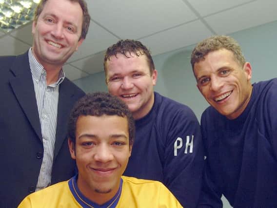 Alex Baptiste signing for Mansfield Town as a teenager