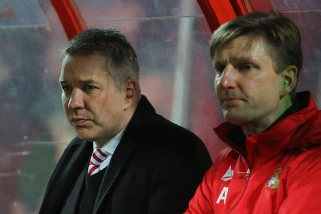 Darren Ferguson and physio Alex Dalton survey the scene at Swindon.