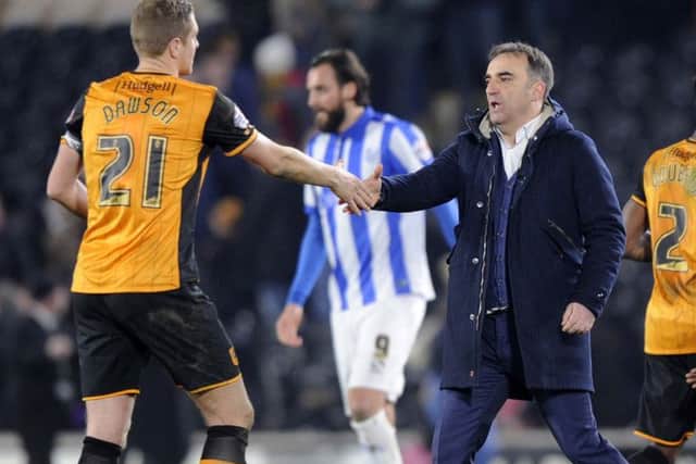 Owls Carlos Carvalhal with Hull City's Michael Dawson at the final whistle