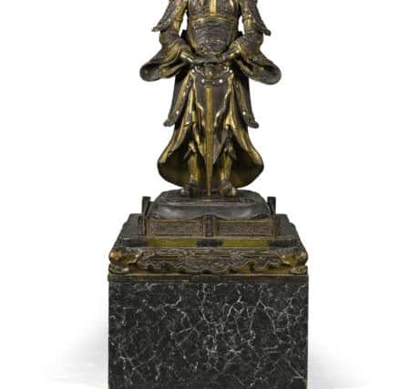 The late Dowager Duchess of Devonshire's possessions are auctioned by Sotheby's of London.

Lot 11 - A Japanese gilt-decorated lacquer guardian figure, Meiji Period, late 19th century, sold for Â£62,500.
