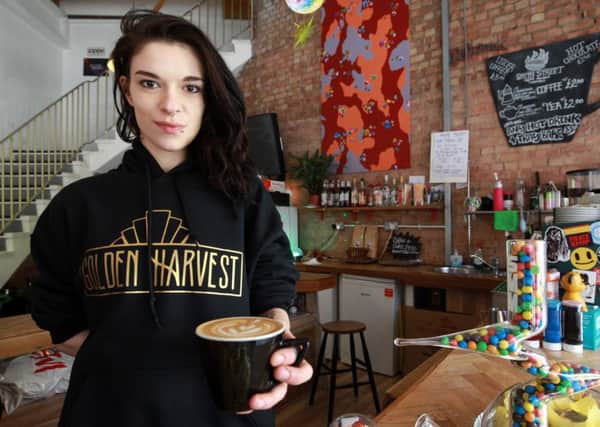 Golden Harvest on Cambridge Street in Sheffield runs a pending coffee scheme in Sheffield - where people buy a coffee in advance that can be given to a homeless or a less fortunate person. Pictured is Charlotte Semark.