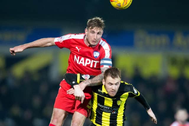 Burton Albion vs Chesterfield - Gary Liddle heads the ball on - Pic By James Williamson