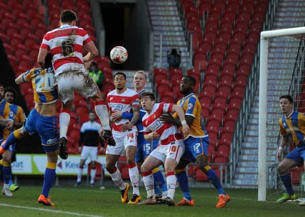 Doncaster's Andy Butler has his header cleared off the line by Shrewsbury's Ian Black