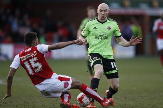 Conor Sammon in a tackle with Victor Nirennold