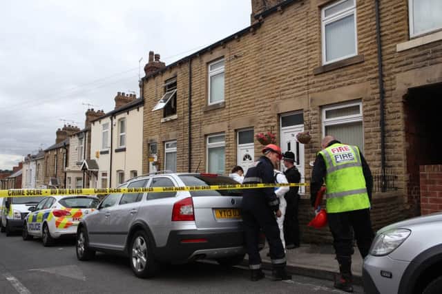 Fire damage at the scene of the fire on Cherry Tree St, Elsecar, Barnsley, South Yorkshire, on 8 July 2015. A man and a woman died at the scene last night (7 July 2015) after firefighters were called to the scene around 6:50pm.  See Ross Parry copy RPYFIRE : Two people have died following a serious house fire in Barnsley. Firefighters rescued an adult male and adult female from the fire on Cherry Tree Street, Elsecar. But despite the considerable efforts of firefighters and ambulance crews at the scene, both sadly passed away. Firefighters were called to the incident at around 6.50pm on Tuesday evening. Three fire engines- from Tankersley and Dearne stations- attended.
See Ross Parry copy 

rossparry.co.uk/Harry Whitehead