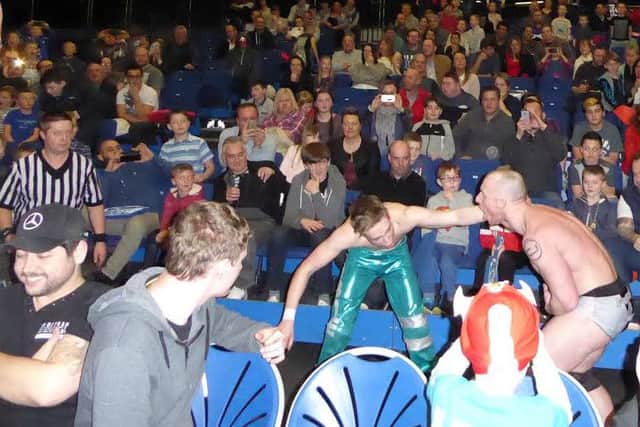 The match between Robbie Mckenzie and CJ Banks spills over into the crowd.