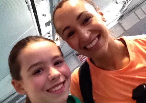 Young athlete Erin Lobley, aged 11, with hero Jess Ennis-Hill