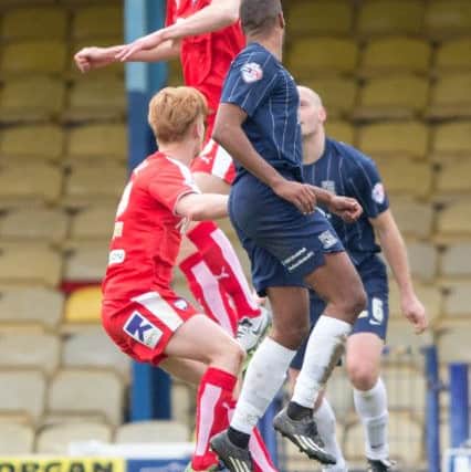 Southend United vs Chesterfield - Tom Anderson rises highest and heads the ball away - Pic By James Williamson
