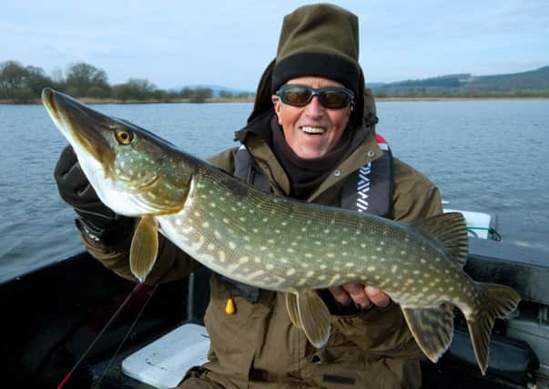 Bob Roberts with a pike - and below, his frosty rod at Loch Ken