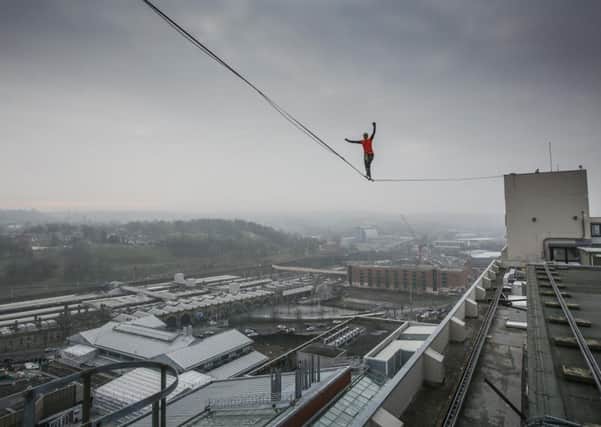 Sarah Rixham, 25, walks a highline over the Sheffield sky line. Picture: Tom Maddick.