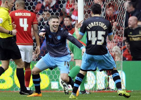 Gary Hooper celebrates his goal at Nottingham Forest with the returning Fernando Forestieri