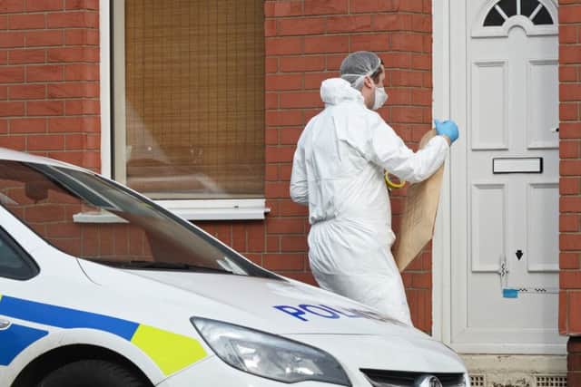 A Crime Scene Investigator enters a property on Cross Street, Balby, where the body of a 43-year-old man was discovered. Picture: Marie Caley NDFP Balby Murder MC 4