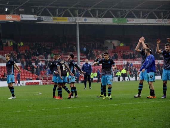 Sheffield Wednesday players applaud their traveling support after a 3-0 win at Nottingham Forest
