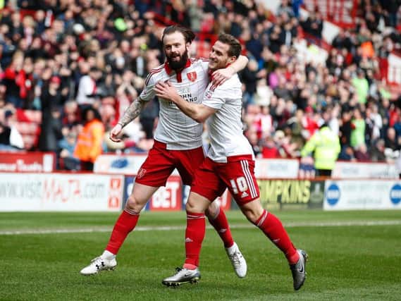 John Brayford celebrates with Billy Sharp after putting Sheffield United 1-0 up against Oldham