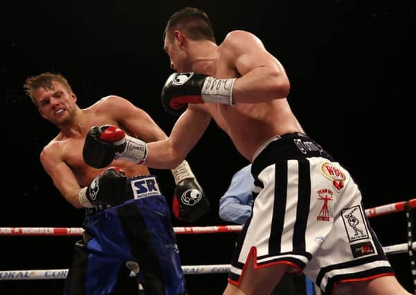 Tommy Langford and Lewis Taylor (left)during the WBO Intercontinental And Vacant Commonwealth Middleweight Championship bout at the Liverpool Echo Arena.