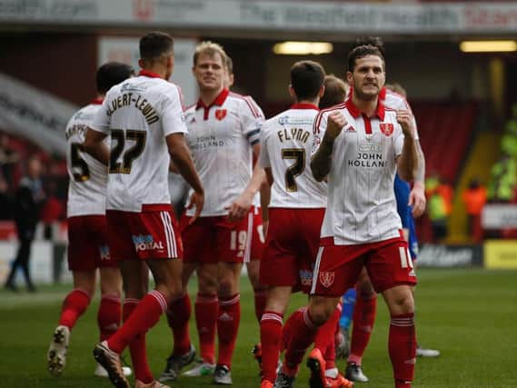 Billy Sharp and his Sheffield United team mates celebrate the third goal against Oldham