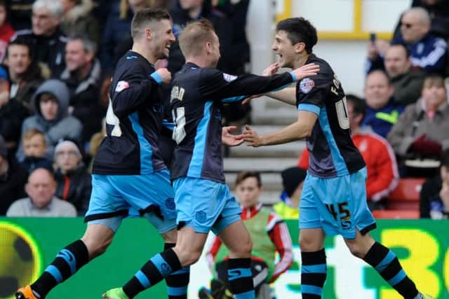 Gary Hooper, Barry Bannan and Fernando Forestieri celebrate Wednesday's second goal against Forest on Saturday