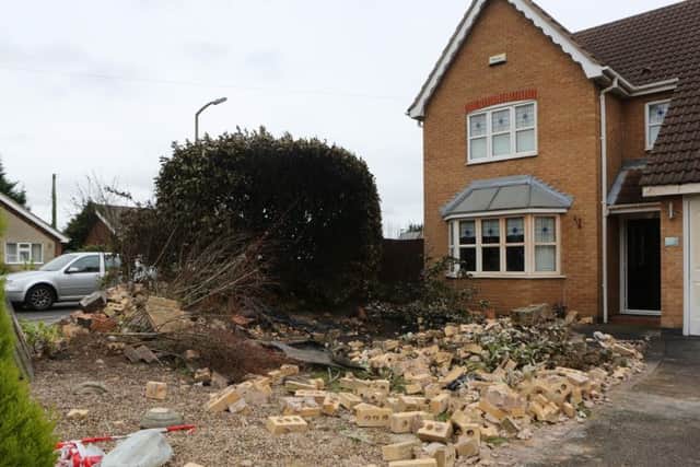 Picture shows the damage left to a house at Poppyfields Way in Branton, near Doncaster in South Yorkshire, after a vehicle crashed into it and burst into flames.
