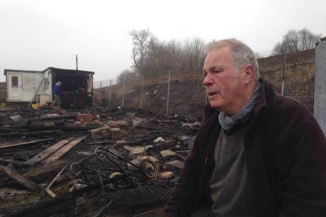 John Holmes, 73, at his allotment in Barnsley where his pigeons and chickens were killed in a fire.