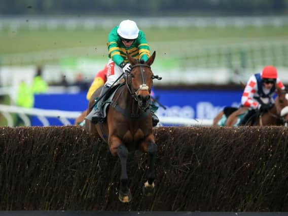 Minella Rocco ridden by Derek O'Connor jumps the last fence on the way to winning the 146th Year Of The National Hunt Chase Challenge Cup during Champion Day of the 2016 Cheltenham Festival at Cheltenham Racecourse. PRESS ASSOCIATION Photo.