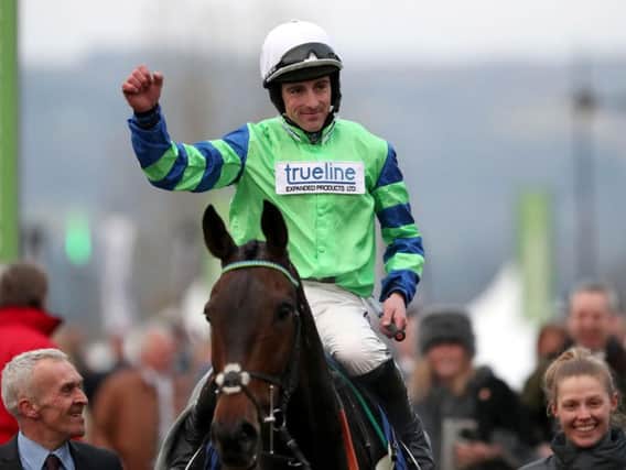 Jockey Brian Hughes celebrates on board Ballyalton after victory in the Close Brothers Novices' Handicap Chase during Champion Day of the 2016 Cheltenham Festival at Cheltenham Racecourse. PRESS ASSOCIATION Photo