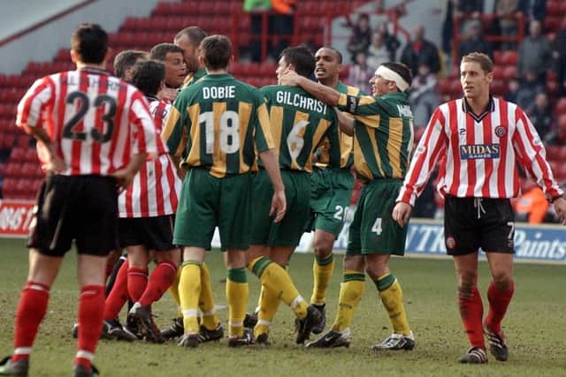 Players from Sheffield United and West Brom argue with each other during the Nationwide League Division One match at Sheffield United's Bramall Lane ground, Saturday March 16, 2002