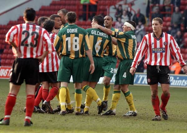 Players from Sheffield United and West Brom argue with each other during the Nationwide League Division One match at Sheffield United's Bramall Lane ground, Saturday March 16, 2002