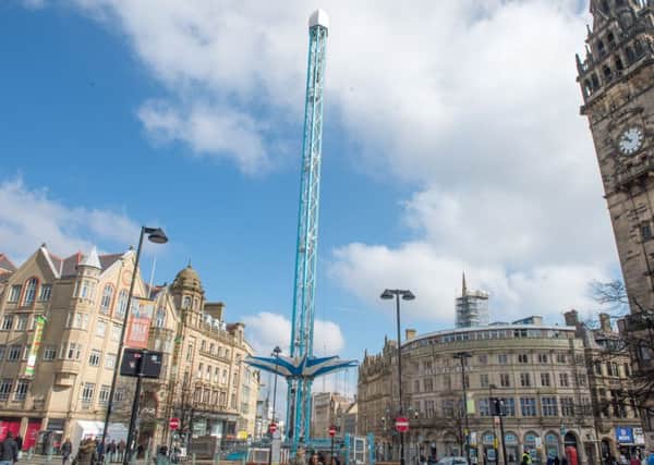 High flying carousel being constructed at the top of Fargate in Sheffield