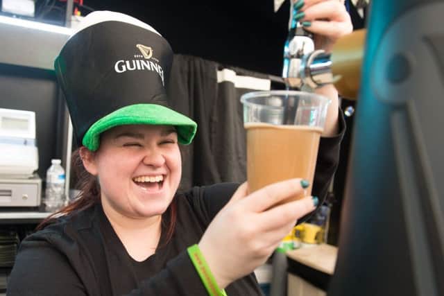 St Patricks Day celebration getting under way for the staff of the Frog and Parrot on Devonshire Green
Siobhan Humphries pours a pint of Guinesss
