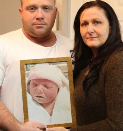 Lisa Fletcher and husband Nik with mementoes of daughter Lillie-Grace