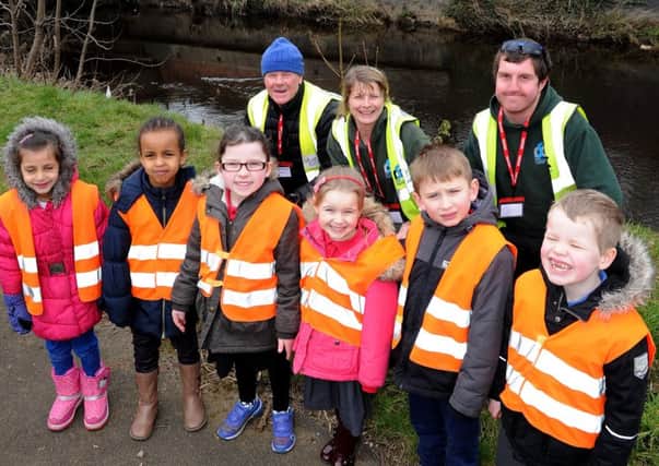 Pupils from Brightside School at the River Don where they have released hand reared brown trout into the river with help from the river stewardship company. Picture: Andrew Roe