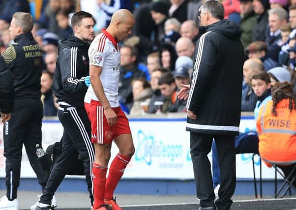 Nigel Adkins looks on as Alex Baptiste goes off injured during the League One match against Millwall