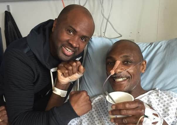 Sheffield-tranied boxer Herol Graham in hospital with friend and fellow boxer Colin McMillan.