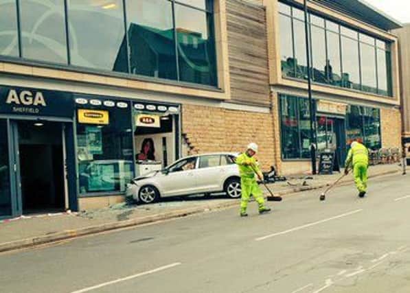 A two-vehicle crash caused a car to collide with a shop window on Ecclesall Road at around 1.25pm on March 20. Picture courtesy of South Yorkshire Police.