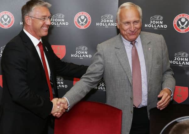 Nigel Adkins (left) shakes hands with co-chairman Kevin McCabe, during his unveiling as the new manager of Sheffield United