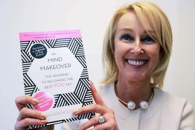 Author and life coach Sharron Lowe pictured with her book The Mind Makeover.