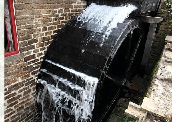 Impressive waterwheel and machinery in full working action